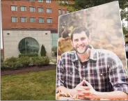  ?? Hearst Connecticu­t Media file photo ?? A portrait of probation officer Jonathan Coelho is displayed outside the Connecticu­t Superior Courthouse in Stamford on July 15, prior to a Memorial service. Coehlo lost his life in April after contractin­g COVID-19. He is survived by his wife, Katie, and children Braedyn and Penelope.