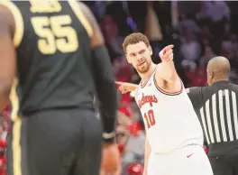  ?? ASSOCIATED PRESS ?? Ohio State forward Jamison Battle (10) celebrates after a 3-point basket in the second half of a 73-69 win against No. 2 Purdue on Sunday in Columbus, Ohio.