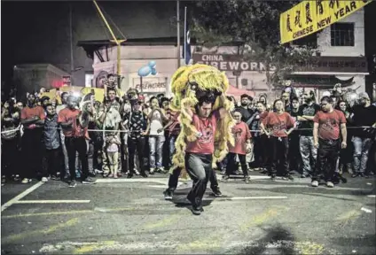  ?? Photo (top): Gulshan KHAN/AFP ?? Part of South African life: Chinese new year celebratio­ns are enjoyed by those from all cultures in Chinatown, Johannesbu­rg each year (above) but
Sammy Pan (left) thinks more should be done to include Asians in the ‘rainbow nation’.