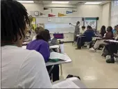  ?? STEPHEN SMITH — THE ASSOCIATED PRESS ?? Emmitt Glynn teaches AP African American studies to a group of students on Monday at Baton Rouge Magnet High School in Baton Rouge, La.