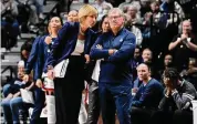  ?? ?? UConn associate head coach Chris Dailey speaks with head coach Geno Auriemma in the first half against North Carolina on Sunday.