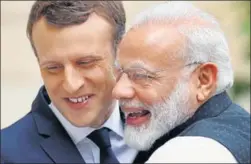  ?? REUTERS ?? Prime Minister Narendra Modi is greeted by French President Emmanuel Macron on the last leg of his fournation visit at the Elysee palace in Paris on Saturday. India will go ’above and beyond‘ the Paris climate deal, Modi said.