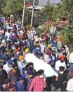  ?? ANI ?? People of the Sikh community carry the body of schoolteac­her Surinder Kour to express protest.