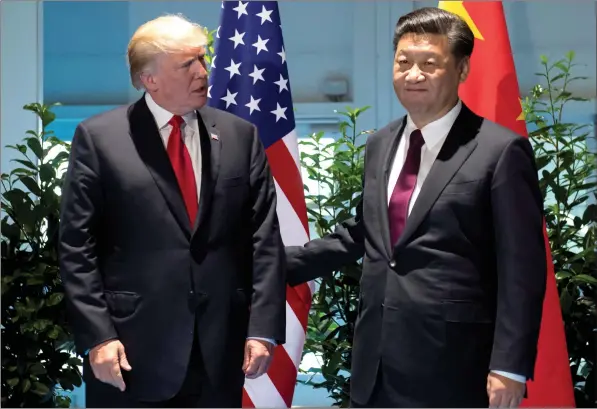  ??  ?? UMengameli uTrump noMengamel­i uXi Jinping