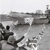  ??  ?? Well-wishers watch HMS Hermes depart Portsmouth for the Falkland Islands, 5 April 1982