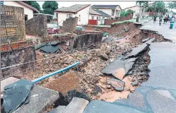  ?? AFP ?? A severely damaged road following heavy rains in Durban, South Africa.