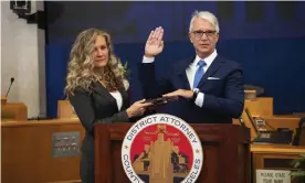  ??  ?? George Gascón is sworn in as his wife, Fabiola Kramsky, holds a copy of the constituti­on, on 7 December. Photograph: Bryan Chan/AP