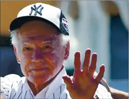  ?? KATHY WILLENS — THE ASSOCIATED PRESS FILE ?? Former New York Yankees pitcher Whitey Ford waves to fans from outside the dugout at the Yankees’ annual Old Timers Day baseball game in New York in 2016. A family member said that Ford died at his Long Island home Thursday night.