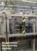  ??  ?? An automated lens assembly machine