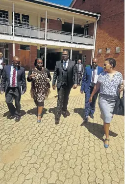  ?? /TWITTER ?? Gauteng education MEC Panyaza Lesufi with his entourage at Three Rivers Secondary School in Vereenigin­g where a pupil was caught on camera in class throwing an exercise book at her female teacher.