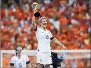  ?? DAVID VINCENT — THE ASSOCIATED PRESS ?? United States’ Megan Rapinoe celebrates her team’s victory with the trophy after the Women’s World Cup final soccer match between US and The Netherland­s at the Stade de Lyon in Decines, outside Lyon, France, Sunday. US won 2:0.