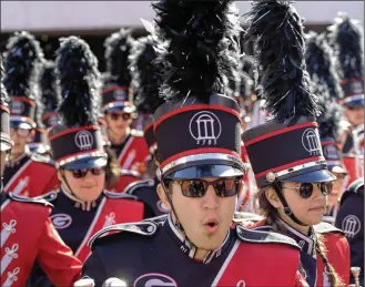  ?? AJC FILE PHOTO 2016 ?? The UGA Redcoat Marching Band dropped “Tara’s Theme” in deference to the national cry against racial injustice. The band now will play “Georgia on My Mind” at games’ end instead.