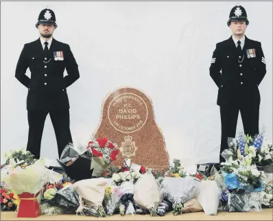  ?? PICTURES: PA. ?? ‘ULTIMATE SACRIFICE’: A memorial stone to Pc Dave Phillips, who was killed by a teenage car thief, has been unveiled in Birkenhead.