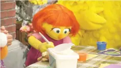  ??  ?? ‘Sesame Street’ is going to introduce a new muppet, Julia who has autism. • (Below) The building of Julia.