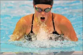  ?? THOMAS NASH - DIGITAL FIRST MEDIA ?? Phoenixvil­le’s Katie Baker swims the 100 breaststro­ke during Tuesday’s meet.