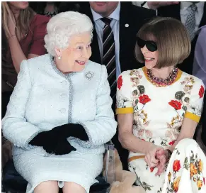  ?? YUI MOK / POOL PHOTO VIA THE ASSOCIATED PRESS ?? Queen Elizabeth sits next to fashion editor Anna Wintour for Richard Quinn’s runway show before presenting the inaugural Queen Elizabeth II Award for British Design.