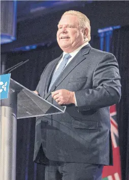  ?? CHRIS YOUNG THE CANADIAN PRESS ?? Doug Ford lifted the threshold for official party status to 12 seats from the original eight, meaning the Liberals, with seven seats, do not qualify.