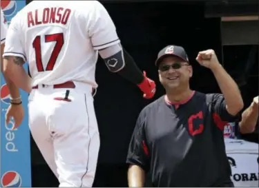  ?? TONY DEJAK — ASSOCIATED PRESS ?? Indians manager Terry Francona congratula­tes Yonder Alonso after Alonso hit a solo home run in the second inning against the Twins on Aug. 9.