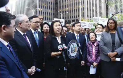  ?? HONG XIAO / CHINA DAILY ?? Congresswo­man Grace Meng joins elected officials and community leaders in front of Fox News headquarte­rs to protest a segment on the O’Reilly Factor program that they feel mocked residents of Chinatown. Meng said that the Asian-American community...