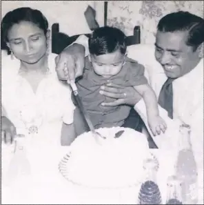  ??  ?? Fiona with her parents Mariam and Mahomed Pathaan Khan on her birthday.