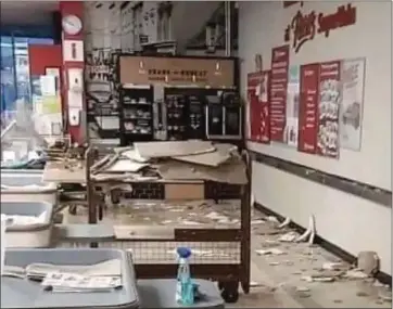  ??  ?? Ceiling collapse in Pettitt’s Super Valu following thundersto­rm on Tuesday evening.