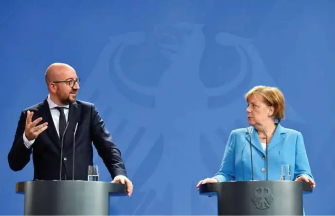  ?? © John Macdougall/afp ?? Charles Michel Angela Merkel: ook zijn regering staat geregeld onder hoogspanni­ng in het asieldebat.