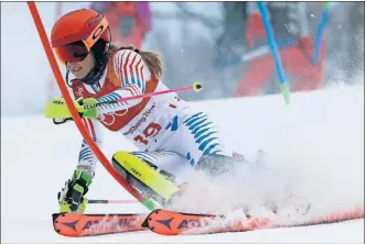  ?? [LUCA BRUNO/THE ASSOCIATED PRESS] ?? Mikaela Shiffrin of the United States races her way to a silver medal in the women’s combined, her second medal of these Olympics.