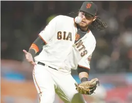  ?? Getty Images/tns ?? Brandon Crawford (35) of the San Francisco Giants bobbles the ball but makes the catch of a pop-up off the bat of Josh Bell (55) of the Pittsburgh Pirates in the top of the seventh inning on Sept. 11, 2019 at Oracle Park in San Francisco.