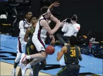  ?? MICHAEL CONROY ?? Gonzaga forward Drew Timme loses control of the ball in front of Baylor guard Macio Teague (31) during the first half of the championsh­ip game in the men’s Final Four NCAA college basketball tournament, Monday, April 5, 2021, at Lucas Oil Stadium in Indianapol­is.