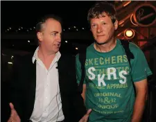  ??  ?? Journalist Paul Williams, left, confronts convicted rapist and suspected murderer Larry Murphy at Dublin Airport in 2011