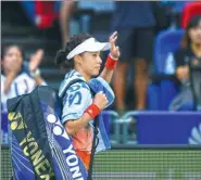  ?? XIAO YIJIU / XINHUA China women’s tennis player ?? China’s Wang Qiang waves to fans after losing her third-round match to Czech third seed Karolina Pliskova at the Wuhan Open on Wednesday. Wang Qiang,