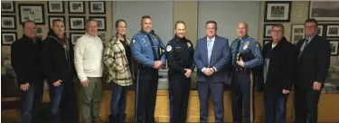  ?? PHOTO COURTESY OF NORTH WALES POLICE DEPARTMENT ?? New North Wales police Chief David Erenius, fourth from right, stands with fellow police chiefs and officers after being sworn in during borough council’s Jan. 25, 2022 meeting.