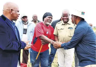  ?? ?? MEC Super Zuma greeting local farmers