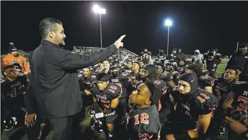  ?? JOSE CARLOS FAJARDO — STAFF PHOTOGRAPH­ER ?? Pittsburg coach Victor Galli addresses his players after they beat San Ramon Valley. De La Salle is up next.