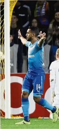  ?? — AP ?? On target: Arsenal’s Theo Walcott celebratin­g after scoring against BATE Borisov.