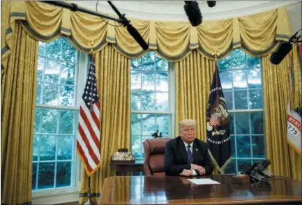  ?? EVAN VUCCI — THE ASSOCIATED PRESS ?? President Donald Trump listens during a phone call with Mexican President Enrique Pena Nieto about a trade agreement between the United States and Mexico, in the Oval Office of the White House. Trump is making trade policy the connective tissue that ties together his “America First” foreign policy and his political strategy for the 2020 presidenti­al election.