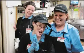  ?? PHOTO BY CALLA KESSLER FOR THE WASHINGTON POST ?? Julie Propp, 57, center, shares a laugh with her co-workers Amanda Torres, left, and Darla Tomlinson, right, at a Kwik Star convenienc­e store in Marshallto­wn, Iowa.