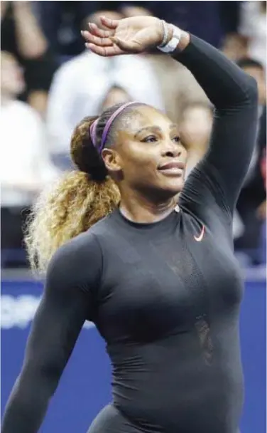  ??  ?? ↑ Serena Williams waves to the crowd after beating Qiang Wang in their quarter-final US Open match on Tuesday.
