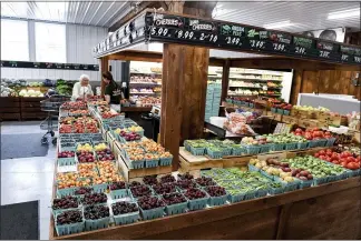  ?? BEN HASTY — READING EAGLE ?? The Weaver’s Orchard market has been expanded to allow additional room for customers to shop.