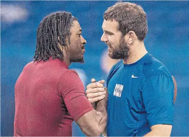  ?? ICON SPORTS WIRE GETTY IMAGES ?? Robert Griffin III, left, is now a backup with the Ravens, while Andrew Luck announced his retirement on Saturday.