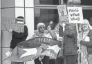  ?? LILY SMITH/THE REGISTER ?? Demonstrat­ors chant and make noise during a protest of the Israel-Hamas war at the Neal Smith Federal Building in Des Moines on Thursday.