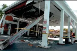  ?? Freeman photos by Tania Barricklo ?? ABOVE: The canopy overhang at the Trailways bus terminal on Washington Avenue in Kingston shows damage Monday after a tractor-trailer avoiding a water main break at the nearby intersecti­on with North Front Street drove under the canopy.