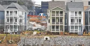  ?? STAFF PHOTO BY C.B. SCHMELTER ?? Homes are seen along the Tennessee River in the Cameron Harbor area on Monday.