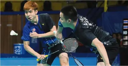  ??  ?? Different strategy: aaron (right) and Wooi yik want to strengthen their defence in order to overcome Indonesia’s Kevin sanjaya-Marcus Fernaldi Gideon.