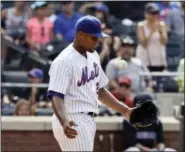  ?? FRANK FRANKLIN II — THE ASSOCIATED PRESS ?? New York Mets relief pitcher Jeurys Familia reacts after a run scored on a wild pitch during the ninth inning against the Colorado Rockies Thursday. The Rockies beat the Mets 2-1.