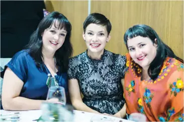  ??  ?? Michelle Cann, Trudy Harrison and Alice Robinson catch up at the dinner and auction. Photograph­s: Amy Wishart