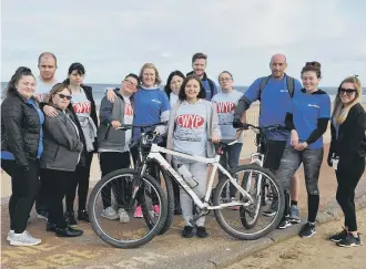  ??  ?? Hays Travel Houghton branch staff take to their bikes to raise money for the Cheesy Waffles Project.