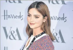  ?? AP PHOTO ?? Actress Jenna Coleman poses for photograph­ers upon arrival at the Victoria and Albert Museum summer party in London in June 2016. Coleman plays a young Queen Victoria in the Masterpiec­e series.