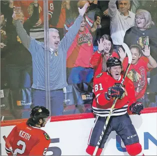  ?? AP PHOTO ?? In this December 2016 file photo, Chicago Blackhawks’ Marian Hossa celebrate his game-winning goal as Duncan Keith (2) watches during the overtime period of an NHL game against the New Jersey Devils in Chicago.