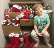  ?? Submitted photo ?? Stitch It Forward Society volunteers have crafted Christmas stockings to brighten the holiday season for Lethbridge citizens.